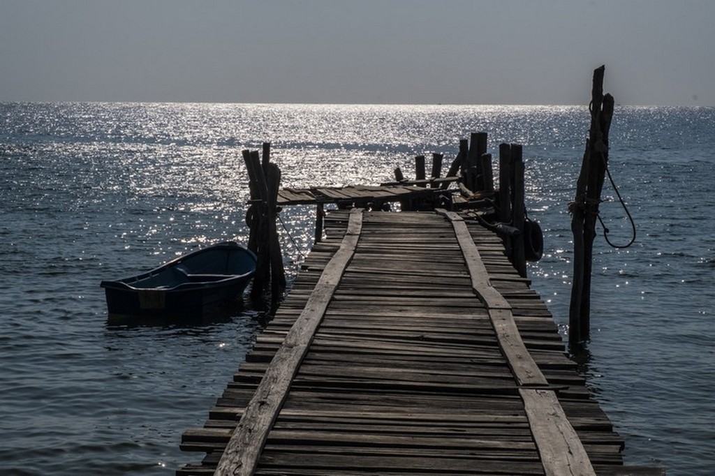 10 cose da fare a Koh Rong Samloem tramonto sul mare dal molo con barche